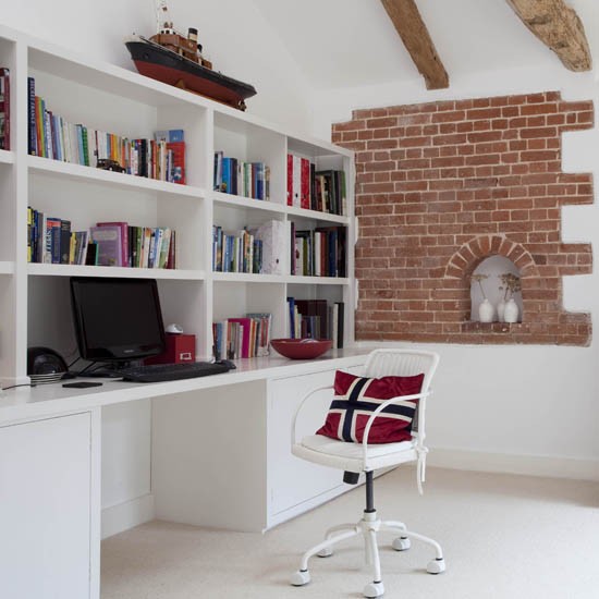 Desk built into a wall of shelves