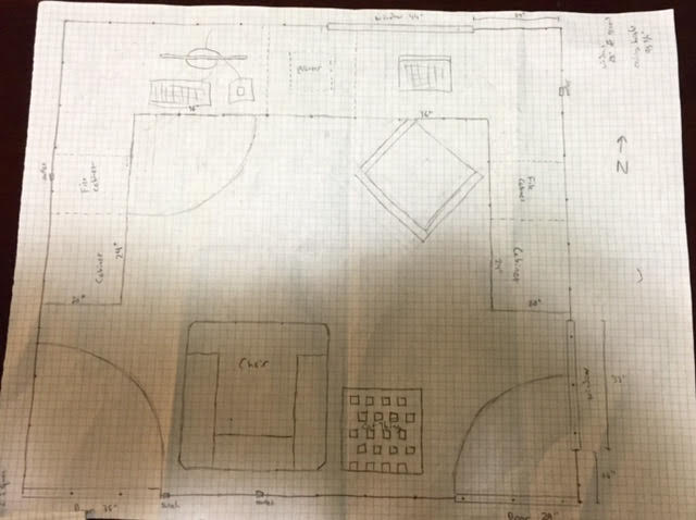 Pencil sketch of an office layout on graph paper